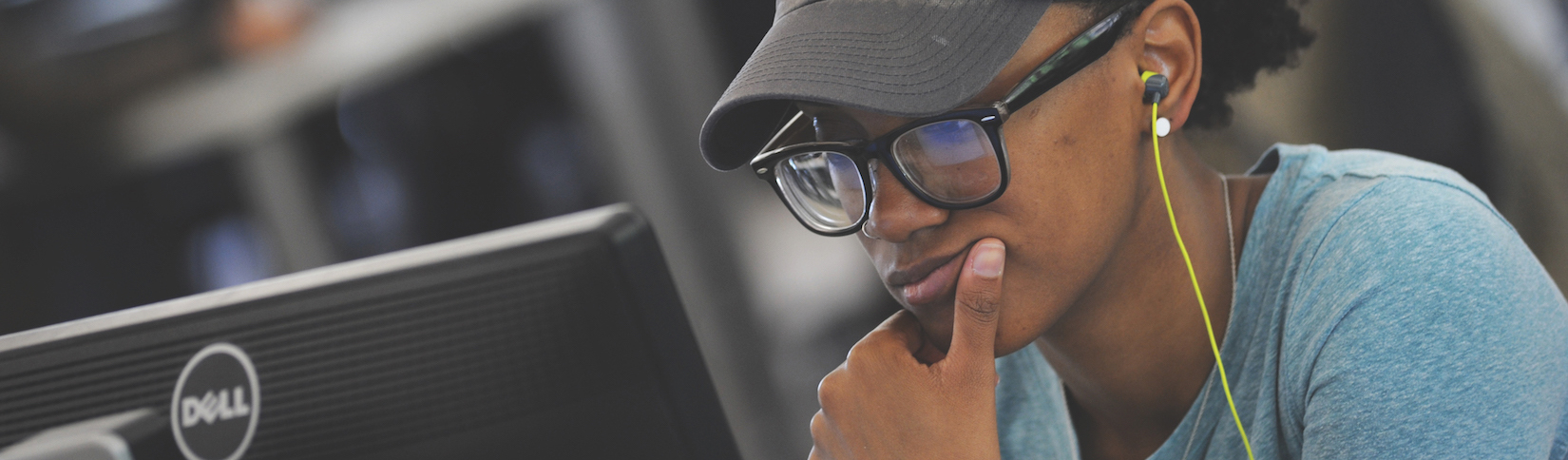 Close up of student working on computer.